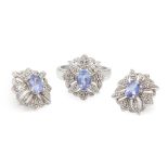 A Tanzanite and diamond cluster ring and matching earrings
