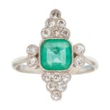 An emerald and diamond set ring