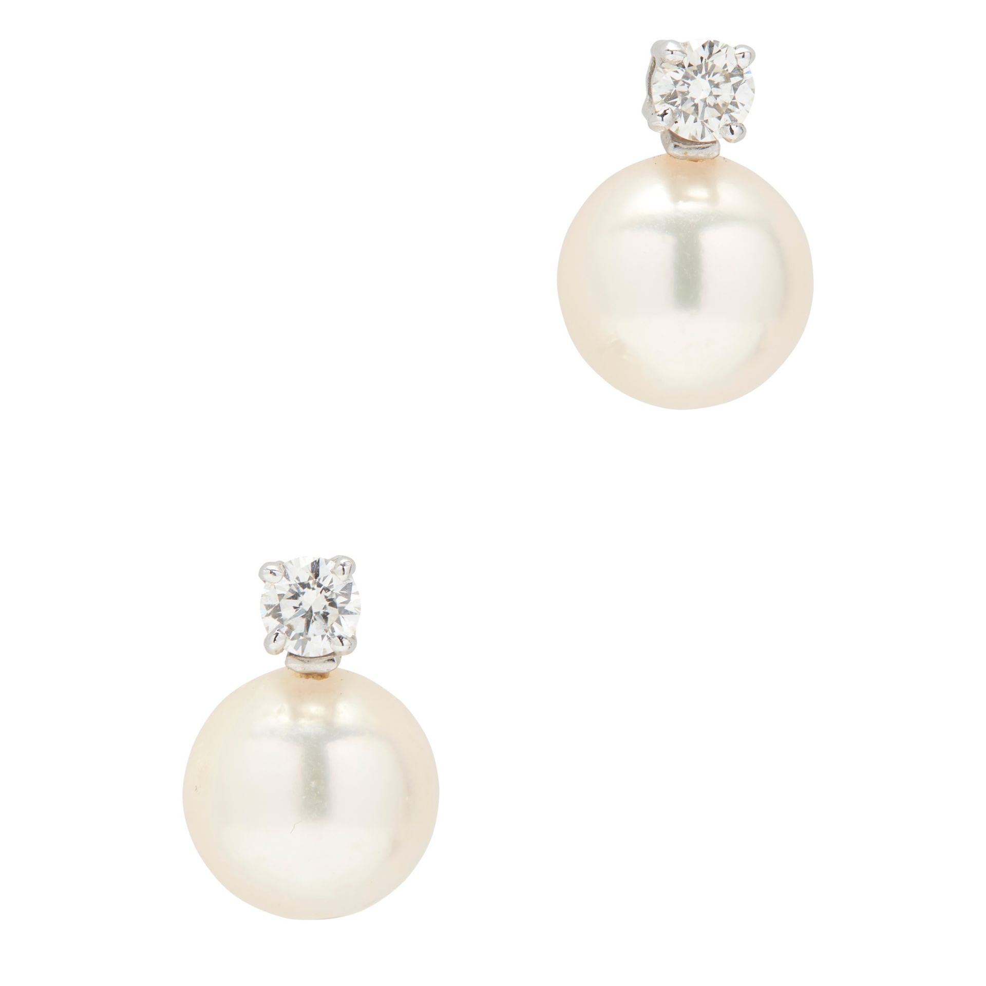 A pair of pearl and diamond set earrings