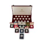 A collection of cased modern proof silver and other coins