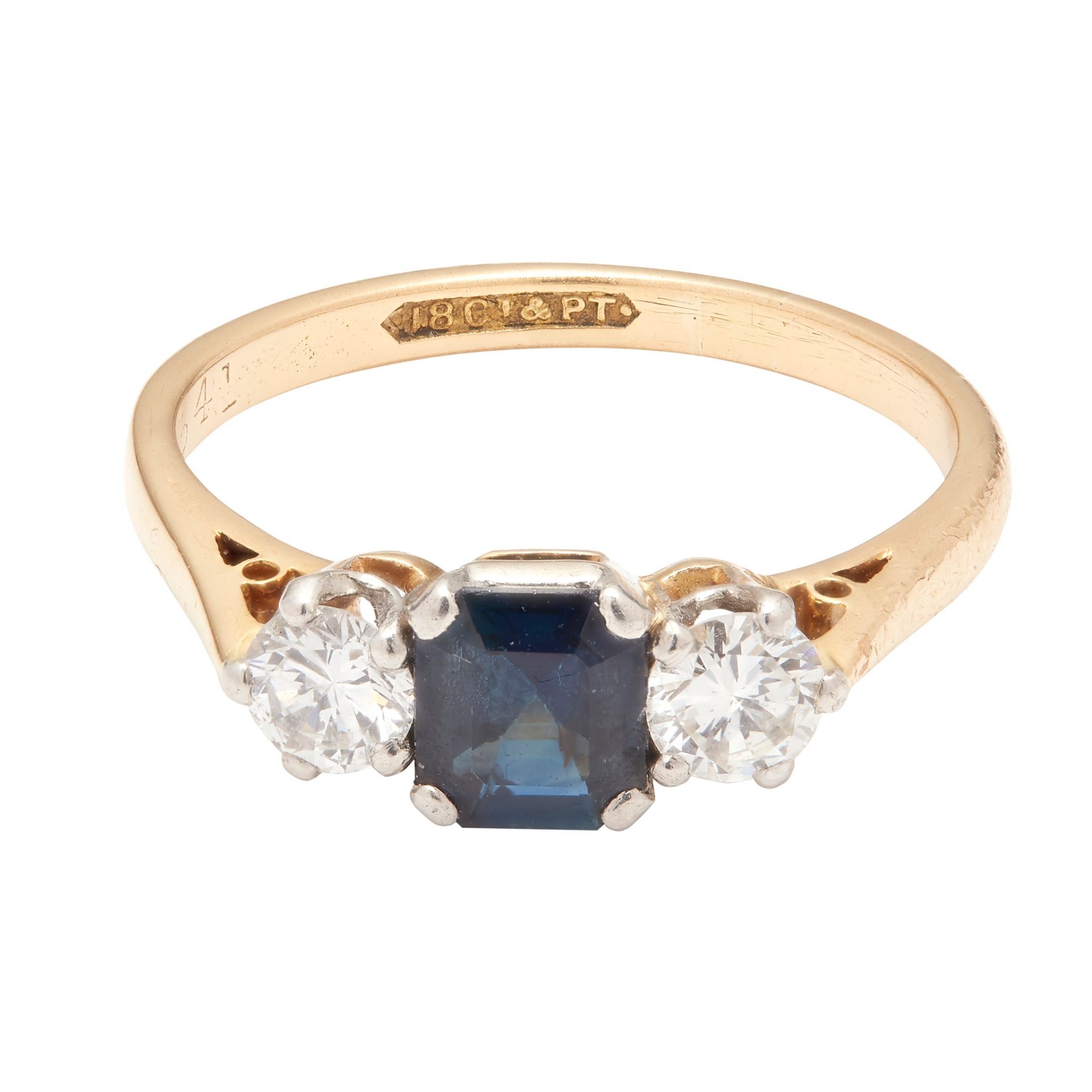 A sapphire and diamond set three stone ring