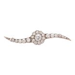 A diamond set bar brooch