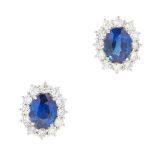 A pair of 18ct gold sapphire and diamond set cluster earrings