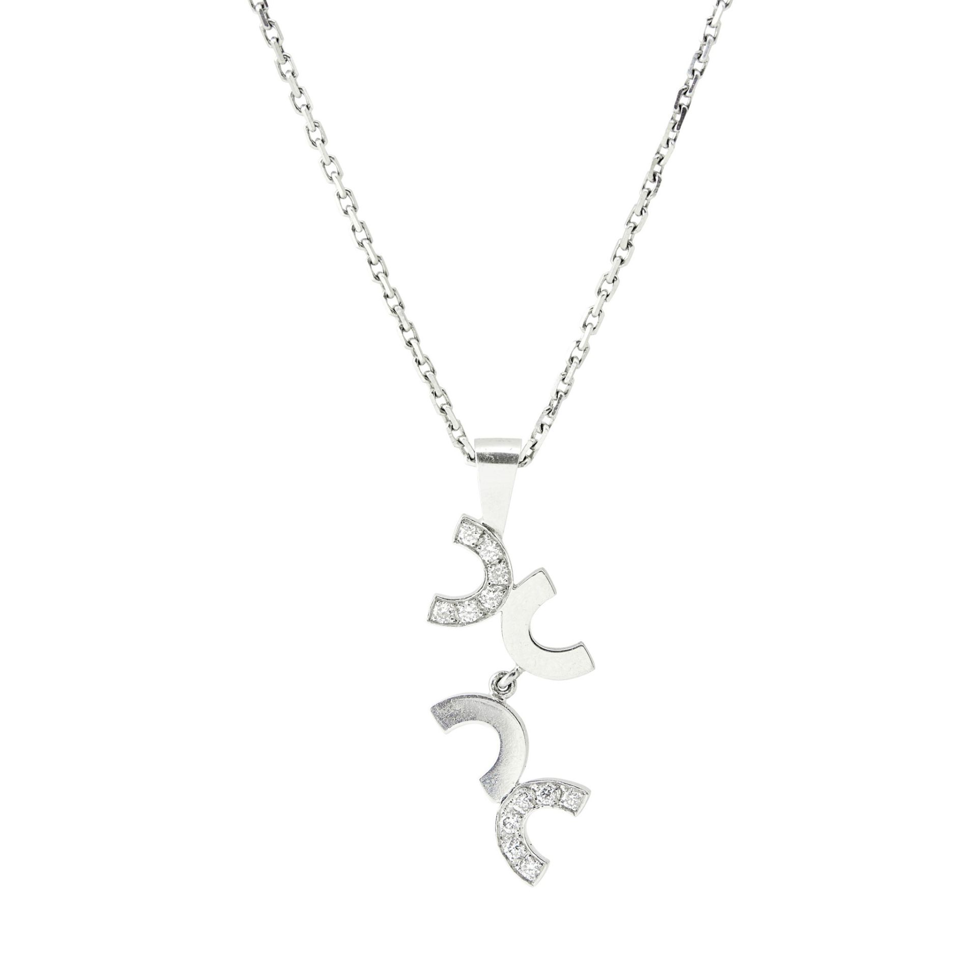 A diamond set 'C' pendant