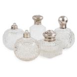 A collection of silver mounted glass dressing table bottles