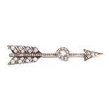 A diamond set arrow brooch