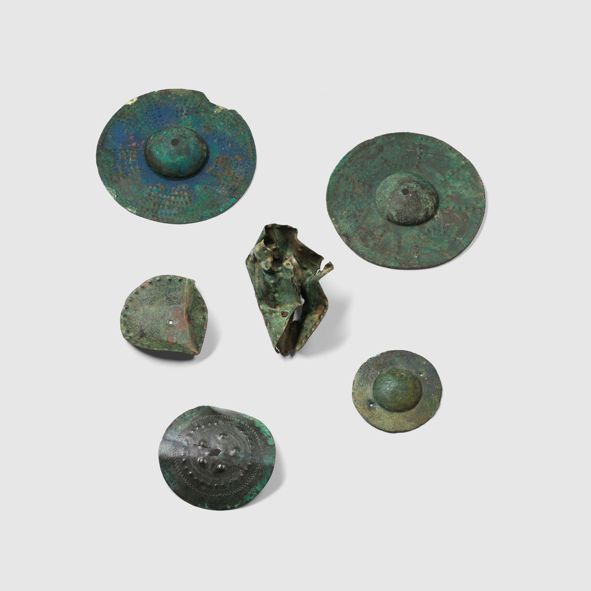 COLLECTION OF ANCIENT NEAR EASTERN SHIELD BOSSES AND FITTINGS NEAR EAST, 1ST MILLENIUM B.C.