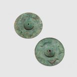 PAIR OF NEAR EASTERN SHIELD BOSSES NEAR EAST, 1ST MILLENIUM B.C.