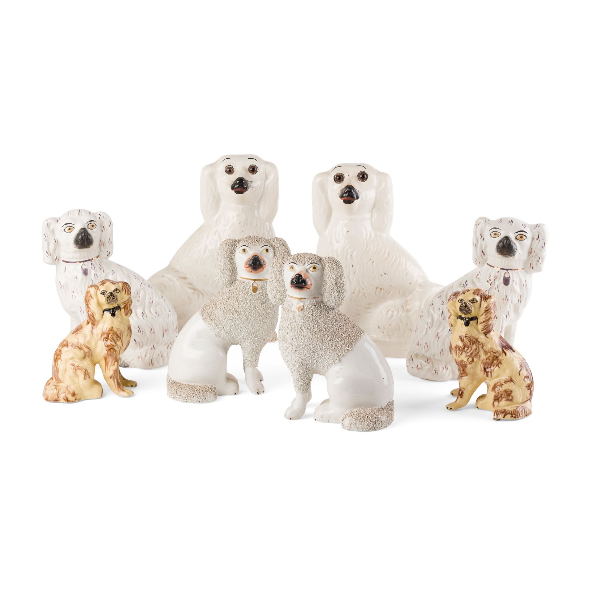 GROUP OF STAFFORDSHIRE POTTERY SPANIELS 19TH CENTURY