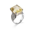 A YELLOW SAPPHIRE AND DIAMOND RING