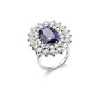 A SAPPHIRE AND DIAMOND CLUSTER RING