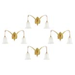 ATTRIBUTED TO THE BIRMINGHAM GUILD OF HANDICRAFT SET OF FOUR ARTS & CRAFTS BRASS WALL SCONCES,