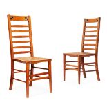 ENGLISH SCHOOL, MANNER OF HEAL & SON, LONDON PAIR OF ARTS & CRAFTS OAK LADDERBACK CHAIRS, CIRCA