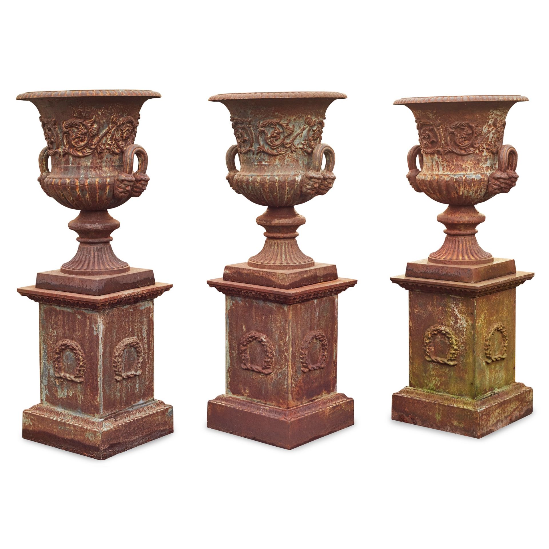 GROUP OF THREE CAST IRON GARDEN URNS AND PLINTHS 20TH CENTURY