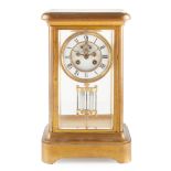 FRENCH BRASS FOUR GLASS MANTEL CLOCK LATE 19TH CENTURY