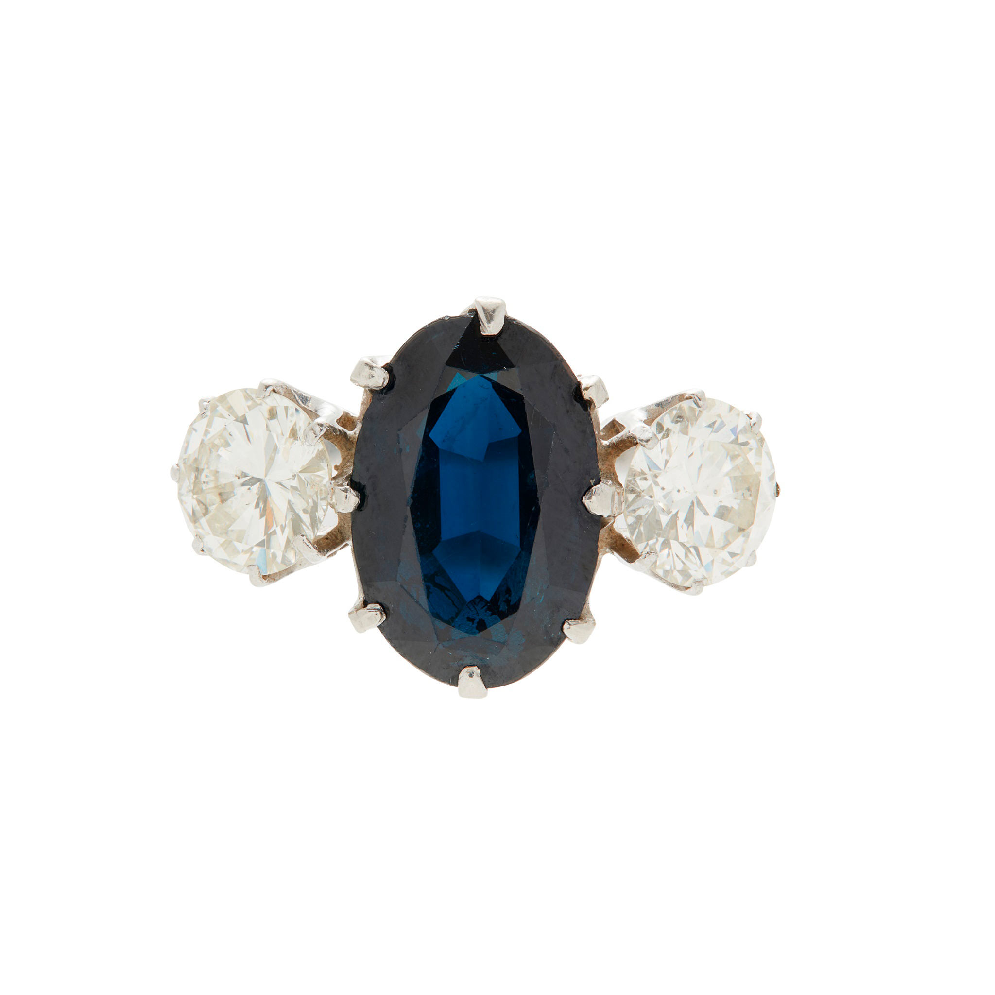 A sapphire and diamond set three stone ring