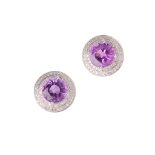 A pair of amethyst and diamond set earrings