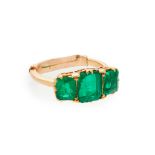 A three stone Colombian emerald set ring