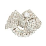 A 1930s/1940s diamond set scrolling brooch