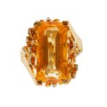 A citrine and diamond set cocktail ring