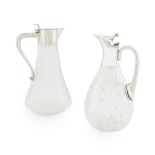 Two silver mounted claret jugs