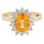 A yellow sapphire and diamond set cluster ring