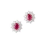 A pair of ruby and diamond set cluster earrings