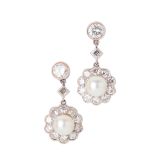 A pair of pearl and diamond set pendant earrings