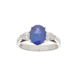 A Tanzanite and diamond set three stone ring