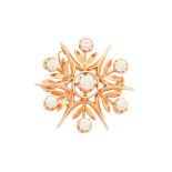 A diamond set star brooch