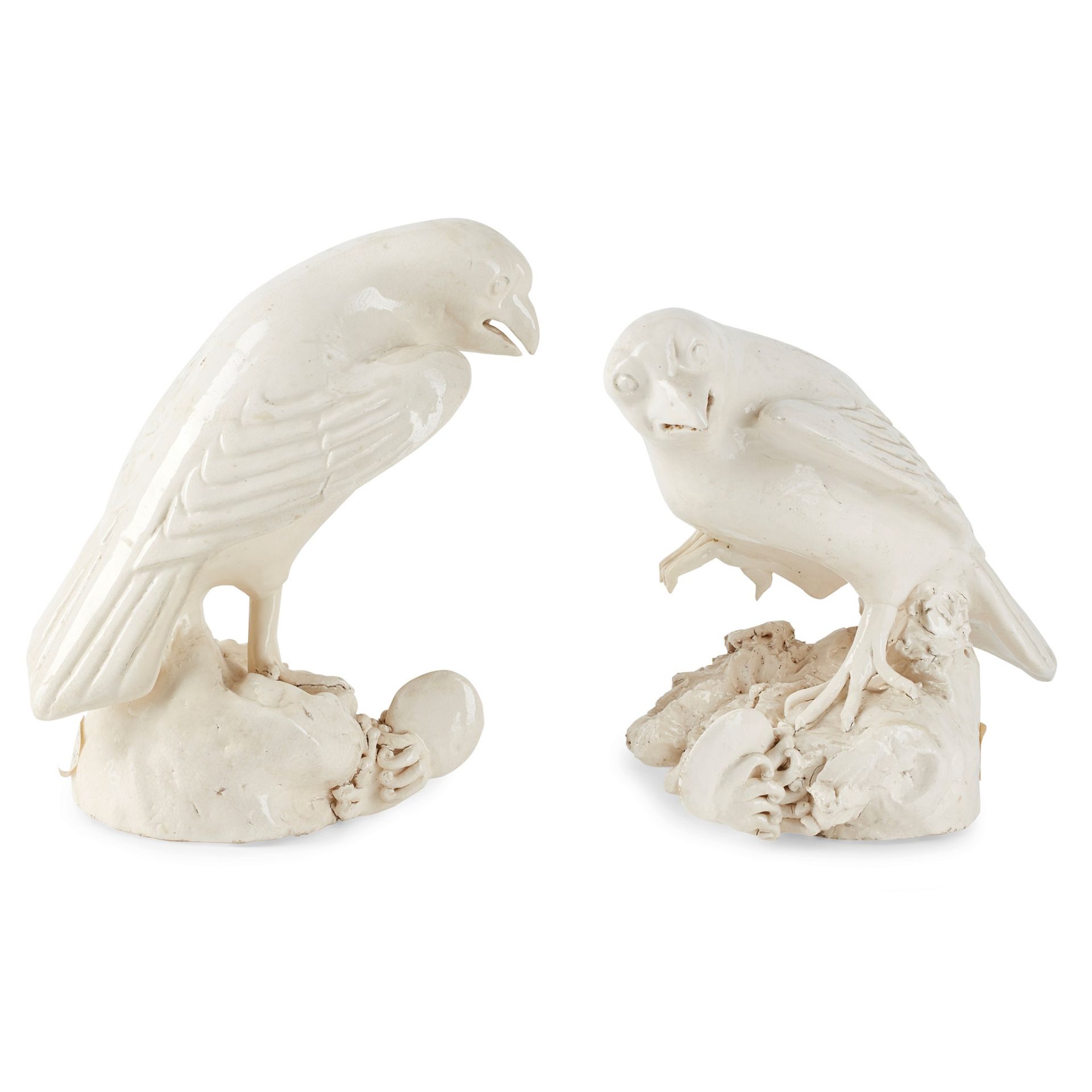 PAIR OF CONTINENTAL WHITE GLAZED POTTERY SEA HAWKS 19TH CENTURY