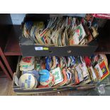 A collection of various beer mats, including German and Dutch, two trays