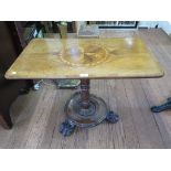 An early Victorian rectangular occasional table, the crossbanded top inlaid with foliate design,