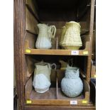 Nine Victorian and later stoneware relief moulded jugs, including three Royal commemorative jugs,