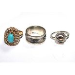 A gold coloured metal and turquoise ring and two silver rings (3)