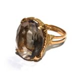 A smoky quartz ring set in 9 carat gold