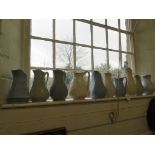 Ten Victorian stoneware relief moulded jugs, all with foliate designs in blue, white or green,