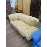 An Edwardian upholstered two seat sofa, with drop arm and square tapering legs, 151 cm long