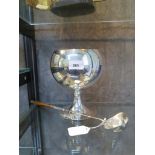 An ice bucket in the shape of a brandy glass together with a silver plated punch/toddy ladle with