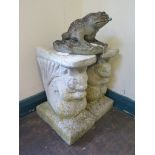 A reconstituted stone garden bench, the rectangular seat on squirrel form supports, 111 cm wide, and