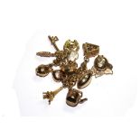 A 9 carat gold charm bracelet with eleven charms