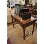 An Edwardian mahogany side table, with two freize drawers on ring turned tapering legs joined by