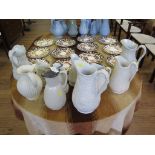 Ten Victorian and later stoneware relief moulded jugs, all in white, including one depicting Arabic,