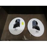 A pair of Coalport porcelain wall plaques with silhouette designs of composers Haydn and Bach by