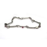 An 18 carat white gold diamond and ruby bracelet