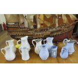 Ten Victorian stoneware relief moulded jugs, in blue or white, including Dudson Brothers