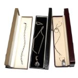 Two 925 silver necklaces with pendants and a 925 silver bangle, all with boxes