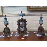A 19th century French porcelain and gilt metal mounted clock garniture set, the panels depicting