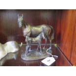 A bronze finish resin sculptures of a Mare and foal, modelled by D. Geenty, 17 cm