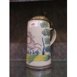 An early 19th century German faience stoneware stein, depicting a stag, the pewter lid engraved with